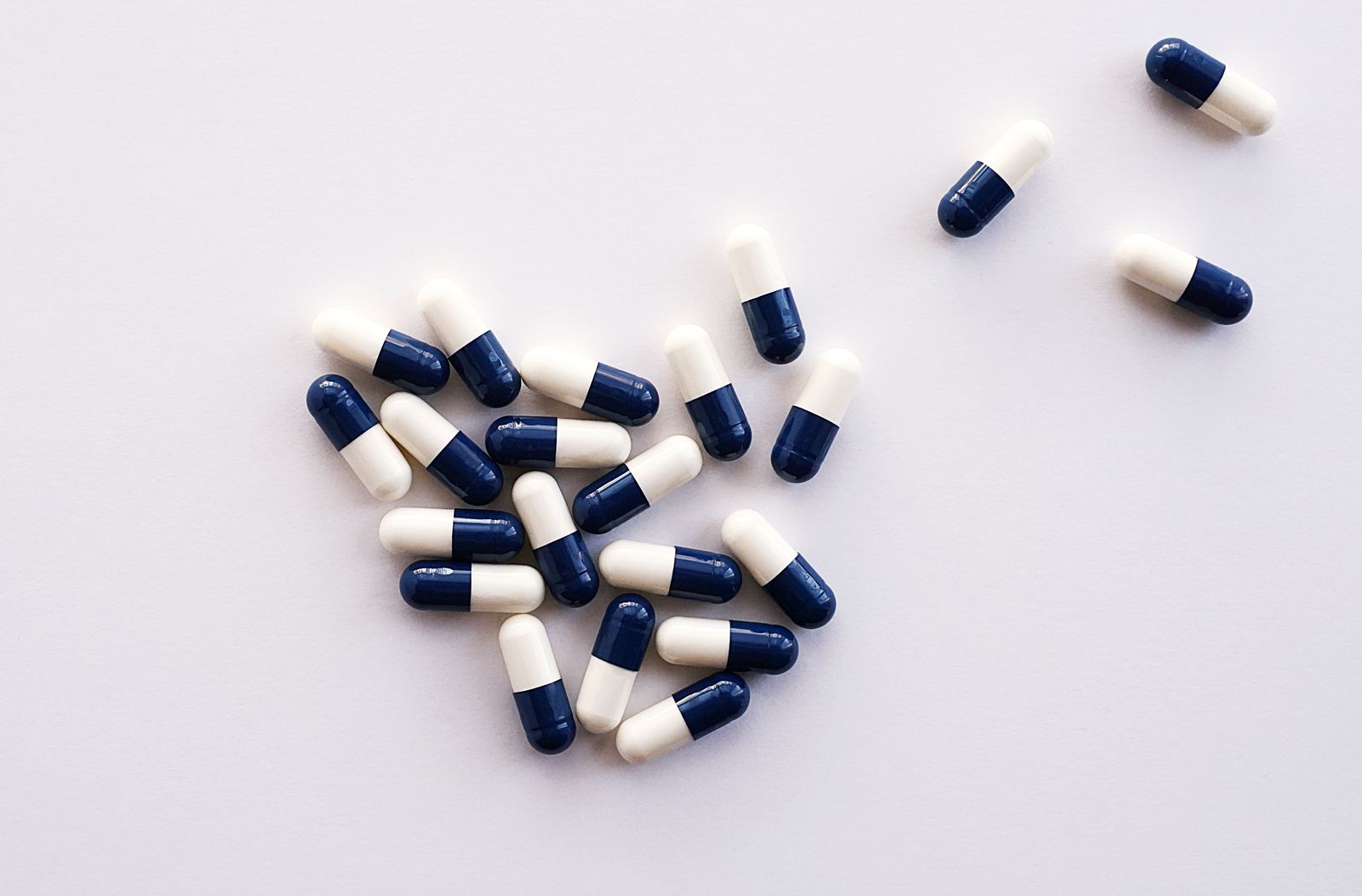 Navy and white medicine capsules